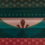 Close-up of Deco Circle mat patterns in pink and teal alongside coordinating fan-patterned designs and The Mahjong House branding