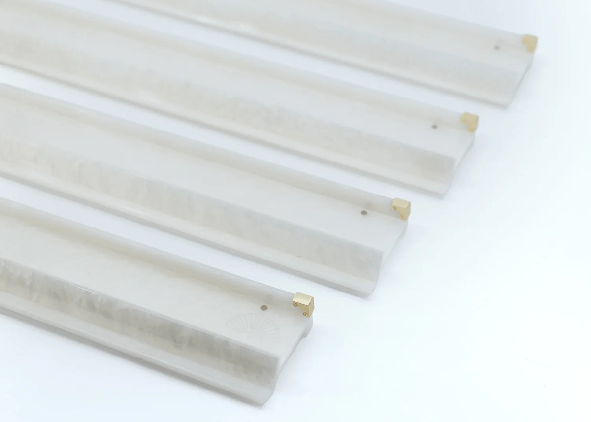 Set of four Miss Mahjong iridescent opal acrylic racks with matching pushers and satin brass corner details.